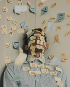 Person with many sticky notes covering their face and upper body, each note filled with to-do reminders, creating a chaotic, overwhelmed scene.